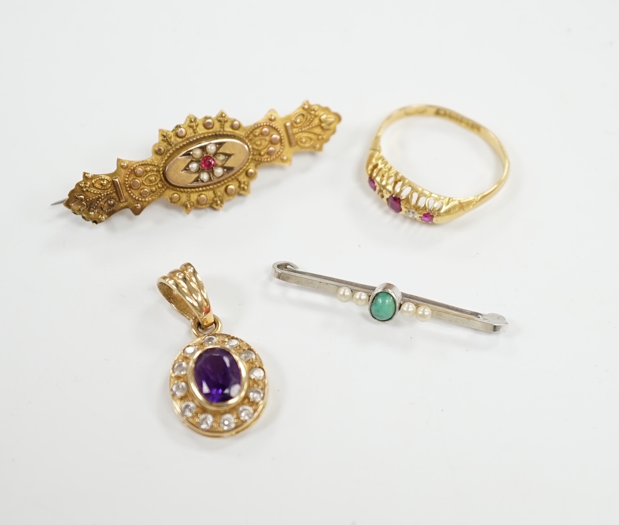 A George V 18ct gold, ruby and diamond set ring (stone missing), together with a 14ct white metal and gem set bar brooch, 32mm, a 9ct and gem set brooch and a modern 9ct gold and gem set pendant. Condition - poor to fair